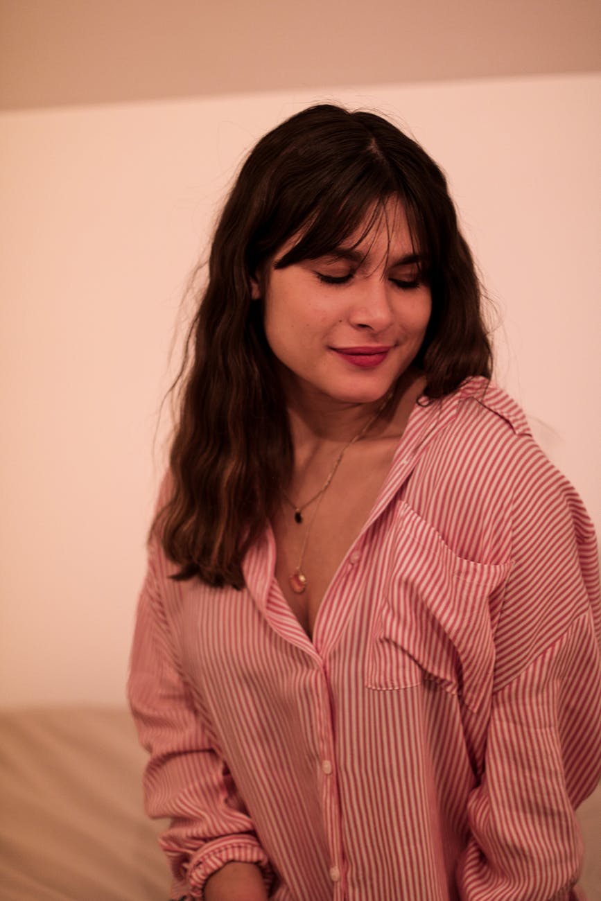 a woman wearing striped long sleeve shirt